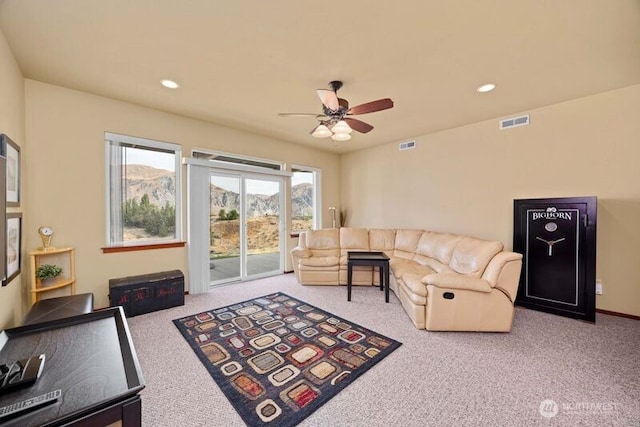 living area featuring carpet, visible vents, a ceiling fan, and recessed lighting