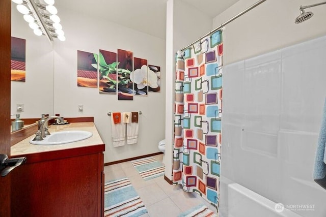 full bathroom with curtained shower, toilet, vanity, baseboards, and tile patterned floors