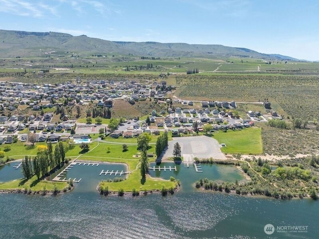 aerial view featuring a water and mountain view