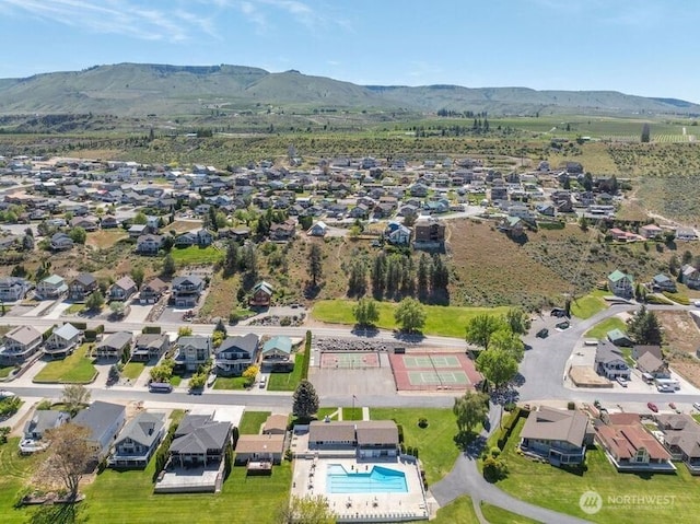 drone / aerial view featuring a residential view and a mountain view