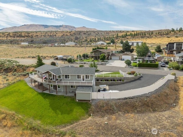 birds eye view of property featuring a mountain view