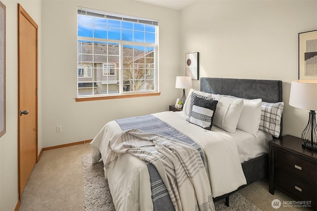 bedroom with carpet and baseboards