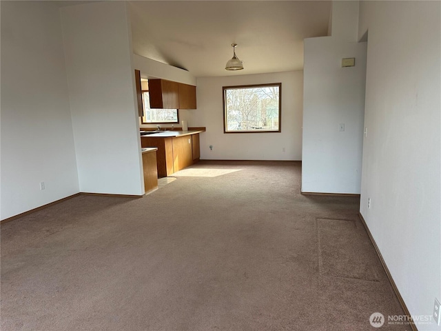 interior space with carpet floors and baseboards