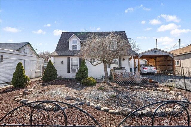 view of front of home featuring fence