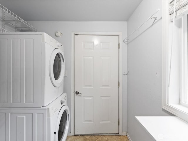 laundry area with laundry area and stacked washer and dryer