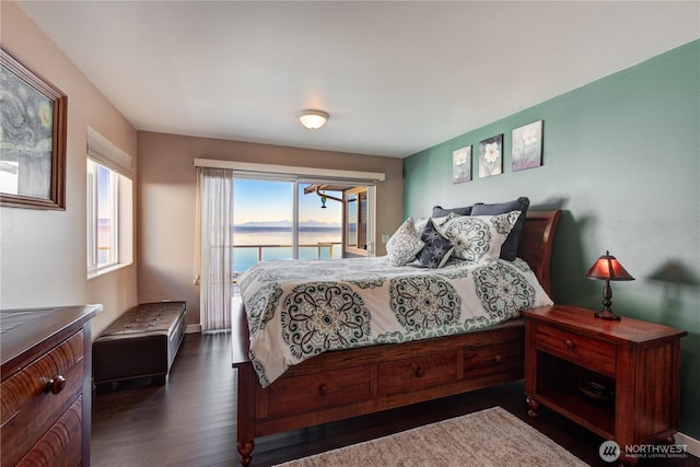 bedroom featuring access to outside and dark wood finished floors