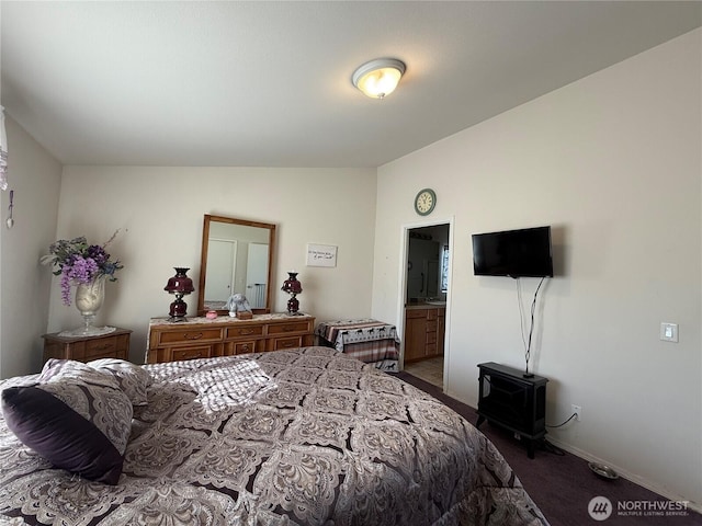 bedroom with carpet, baseboards, and vaulted ceiling