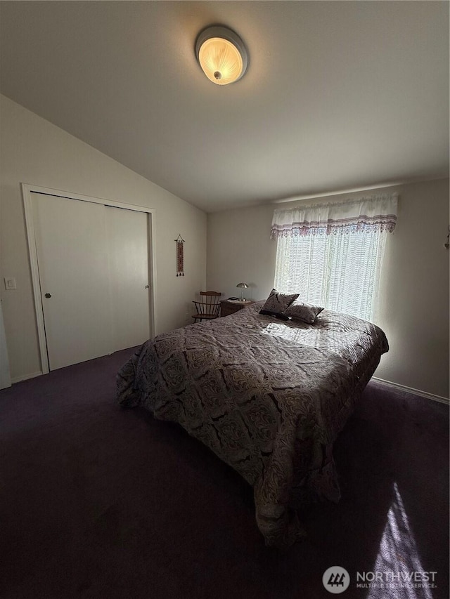 carpeted bedroom featuring vaulted ceiling