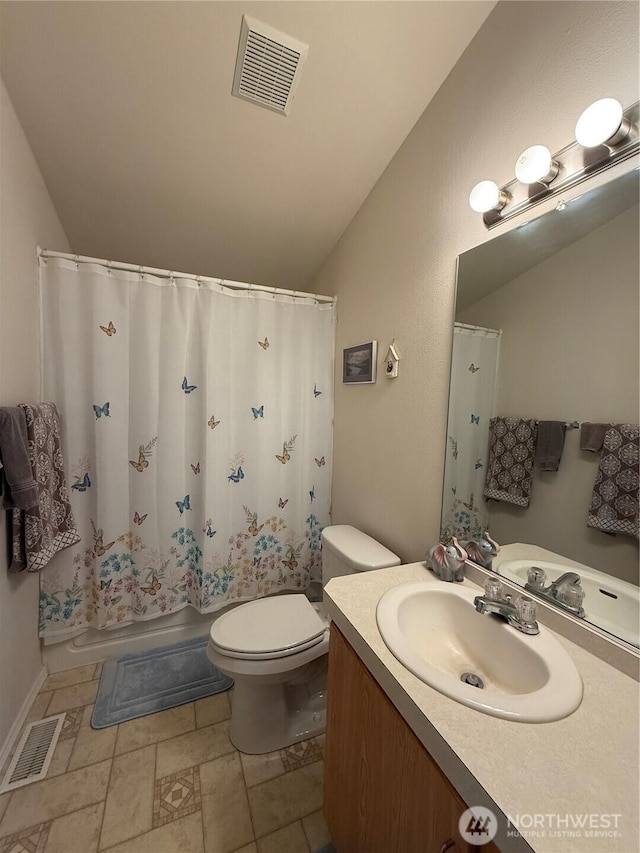 full bathroom featuring visible vents, vaulted ceiling, vanity, and toilet