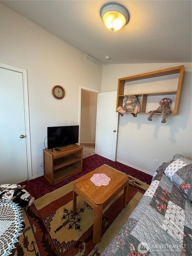 carpeted living area featuring lofted ceiling and visible vents