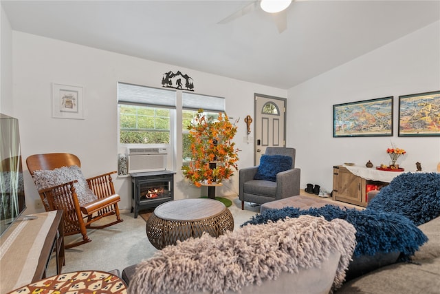 living area with a ceiling fan, carpet, cooling unit, and vaulted ceiling