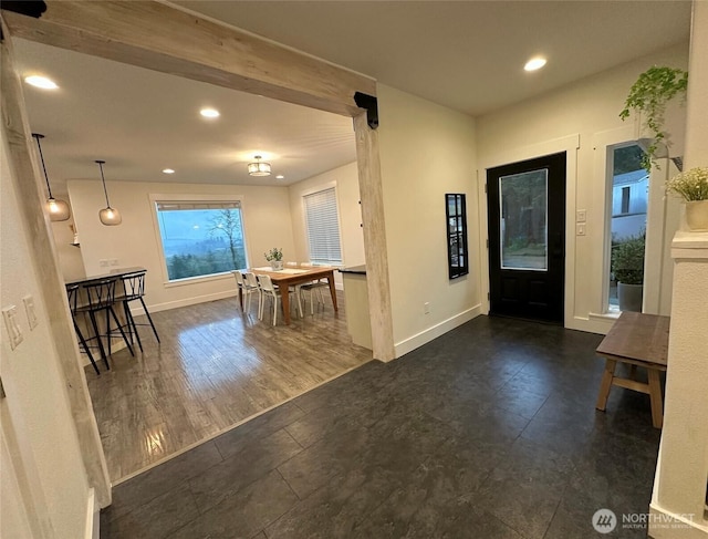 foyer featuring recessed lighting and baseboards