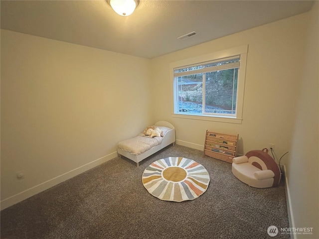 unfurnished bedroom with carpet, visible vents, and baseboards