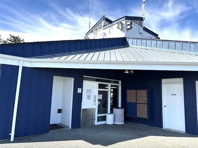 exterior space with metal roof