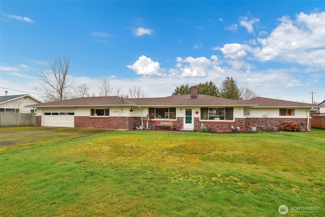 ranch-style home featuring brick siding, an attached garage, fence, and a front yard