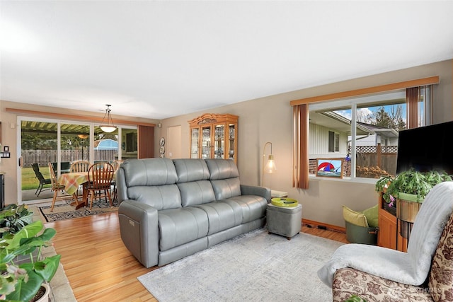 living room featuring baseboards and wood finished floors