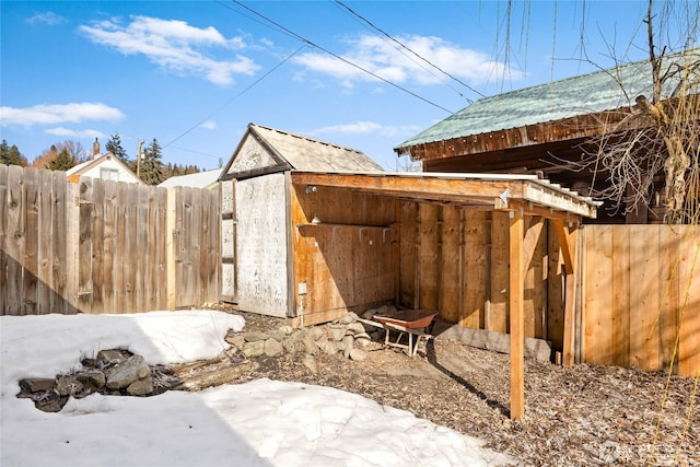 exterior space featuring an outbuilding and fence