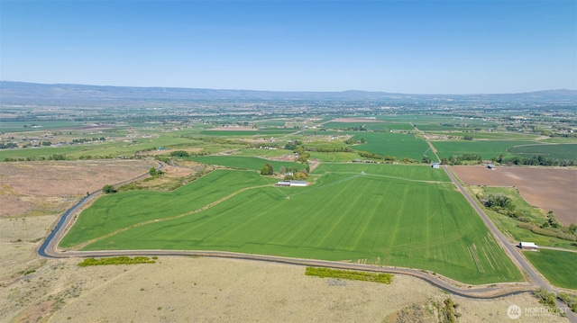 drone / aerial view featuring a rural view and a mountain view