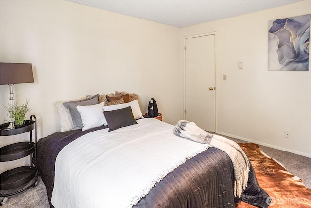 carpeted bedroom featuring baseboards