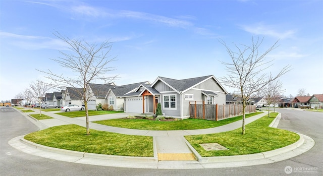 view of front facade featuring a residential view, fence, board and batten siding, and concrete driveway