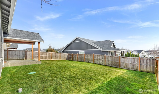 view of yard with a fenced backyard