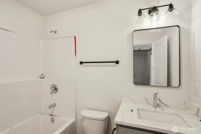 bathroom with vanity, toilet, and shower / bath combination