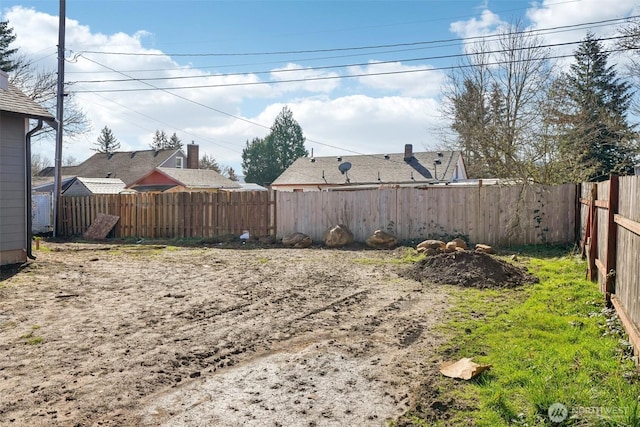 view of yard with fence