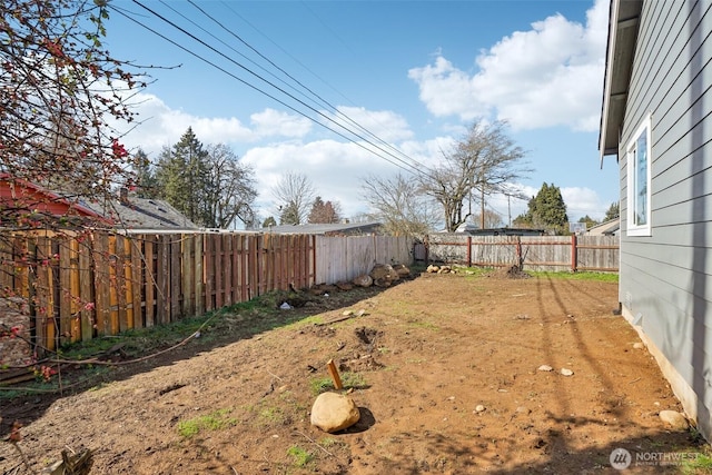 view of yard with a fenced backyard