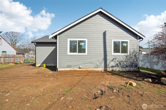 back of property featuring fence