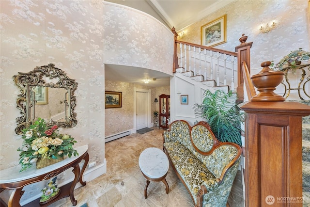 entrance foyer with a baseboard radiator, baseboards, stairway, wallpapered walls, and crown molding