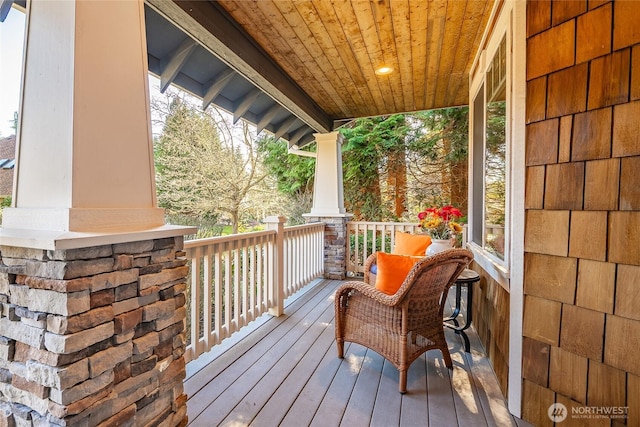 wooden terrace with covered porch