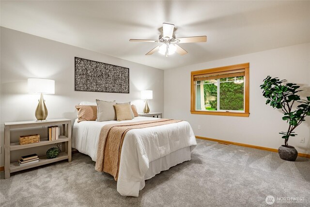 bedroom featuring carpet, baseboards, and a ceiling fan