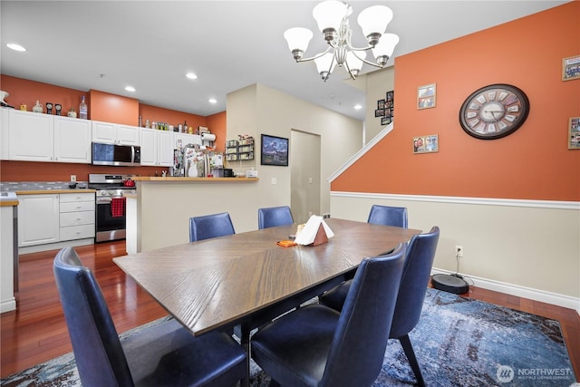 dining room with baseboards, dark wood-style flooring, recessed lighting, and a notable chandelier