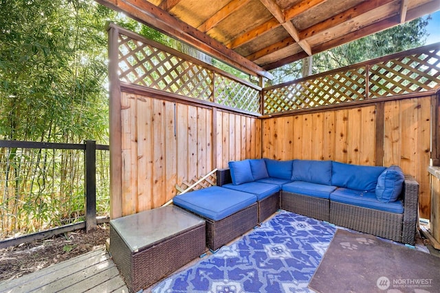 deck with an outdoor hangout area and fence