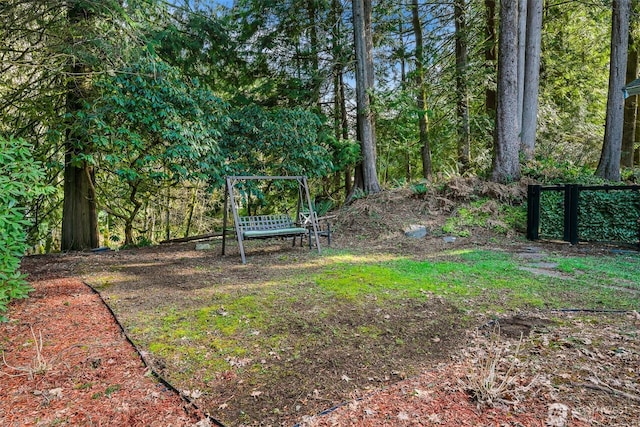 view of yard featuring a wooded view