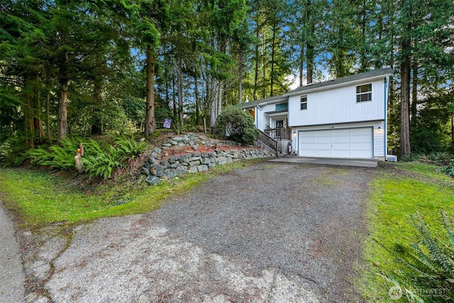 view of front facade featuring driveway and an attached garage