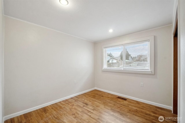 unfurnished room featuring visible vents, recessed lighting, light wood-style floors, and baseboards