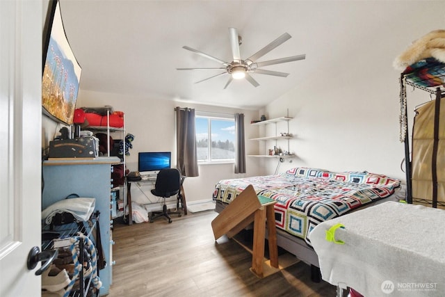 bedroom featuring ceiling fan and wood finished floors