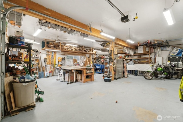 garage featuring a workshop area and a garage door opener