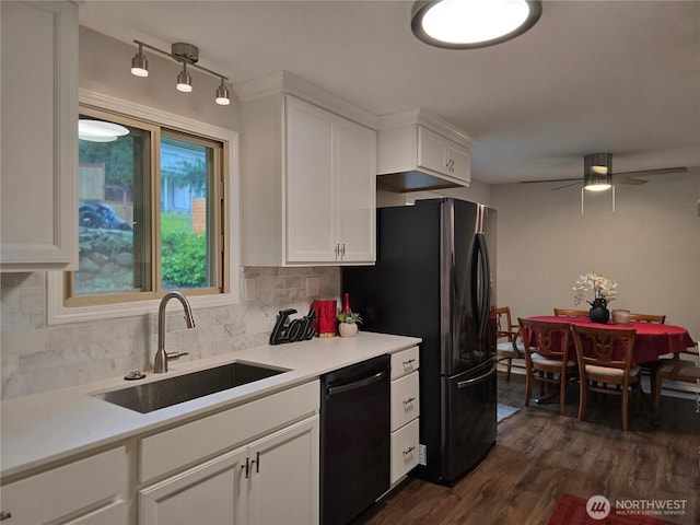 kitchen with dark wood-type flooring, a sink, white cabinets, backsplash, and dishwasher