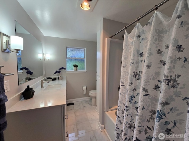 full bath with marble finish floor, baseboards, vanity, and toilet