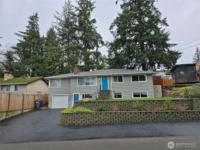 20631 10th Ave S, Des Moines, WA 98198 - view of front of home with driveway, a garage, and a chimney