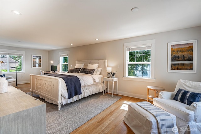 bedroom featuring recessed lighting, baseboards, and light wood-style flooring