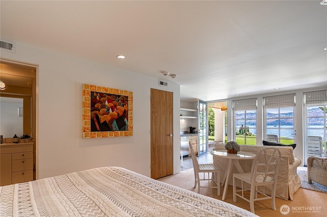 bedroom featuring visible vents and access to outside