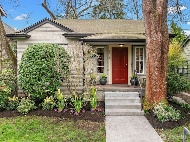 view of front of house with a shingled roof