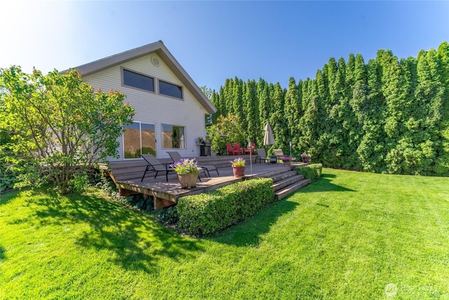 view of yard with a wooden deck