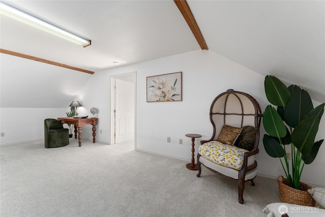 living area featuring lofted ceiling with beams, baseboards, and carpet floors