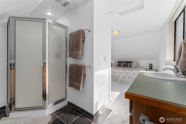 ensuite bathroom with a stall shower, visible vents, and vaulted ceiling