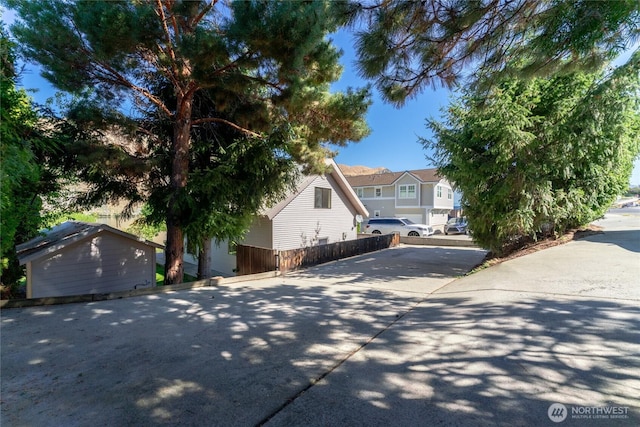 view of side of home with fence