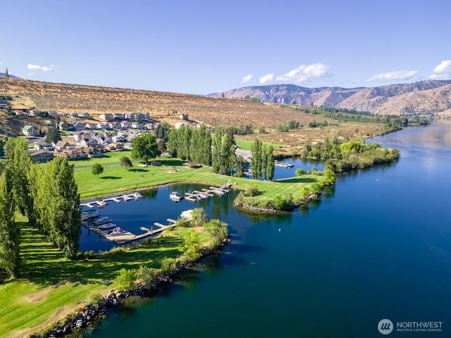 bird's eye view featuring a water and mountain view